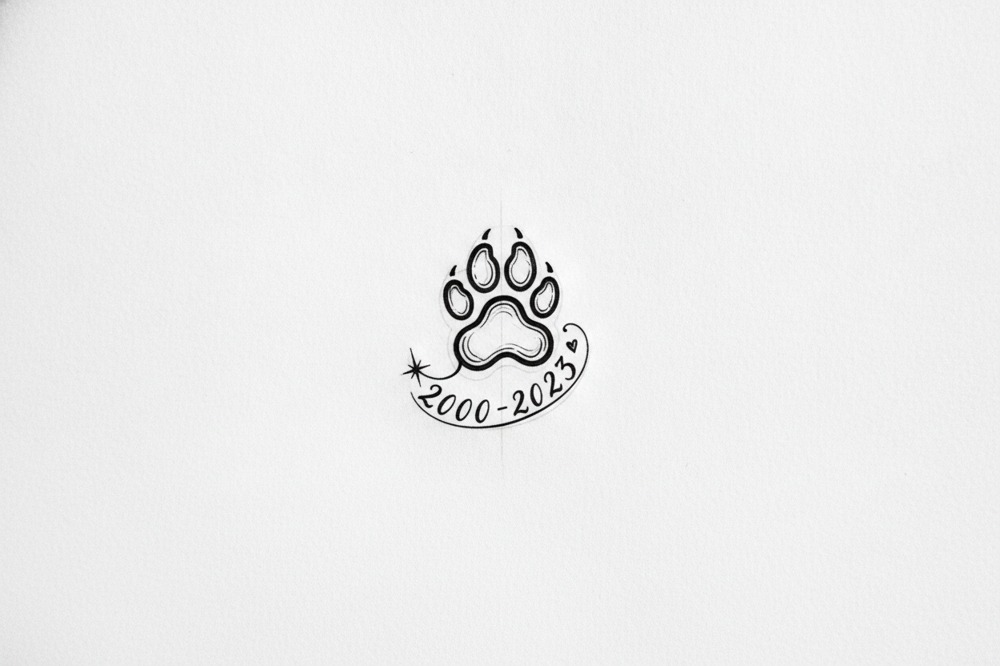How Small Can A Paw Print Memorial Tattoo Go?